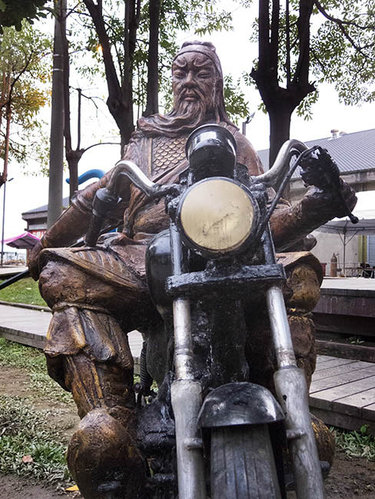 Guan Yu on a Bike