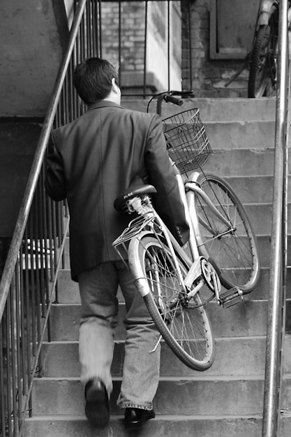 Carrying Up Bicycle